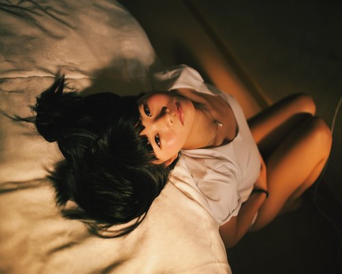 A quiet bedroom setting with soft lighting